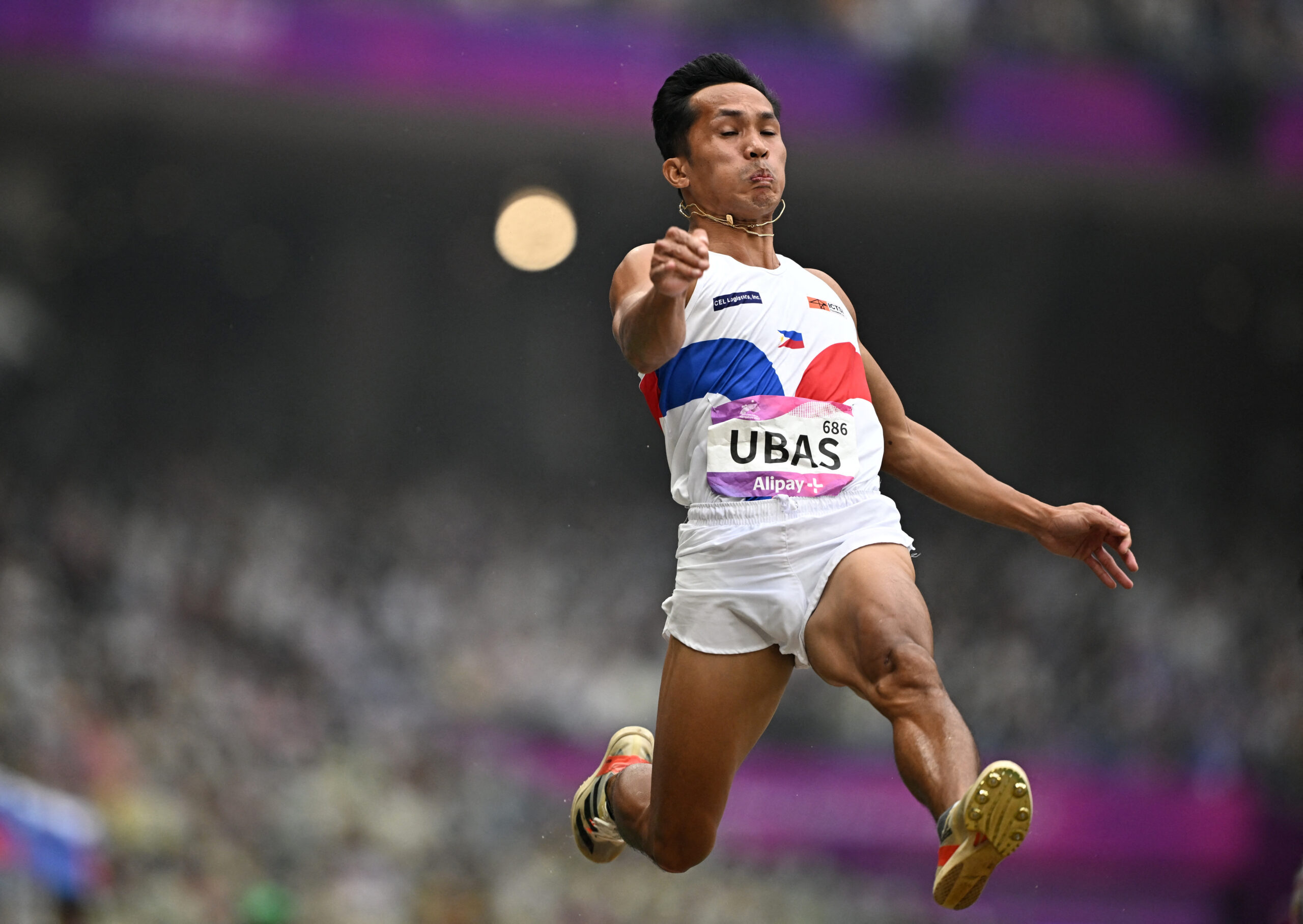 Asian Games - Hangzhou 2022 - Athletics - Olympic Sports Centre Stadium, Hangzhou, China - September 30, 2023 Philippines' Janryv Ubas in action during the men's long jump qualification - group B 