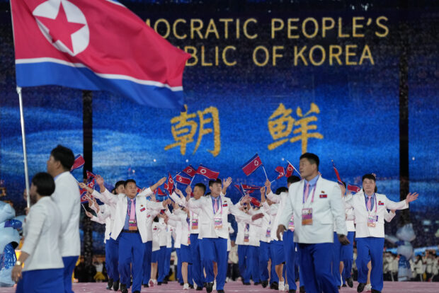 North Korea athletes and team officials arrive during the opening ceremony of the 19th Asian Games in Hangzhou, China, S
