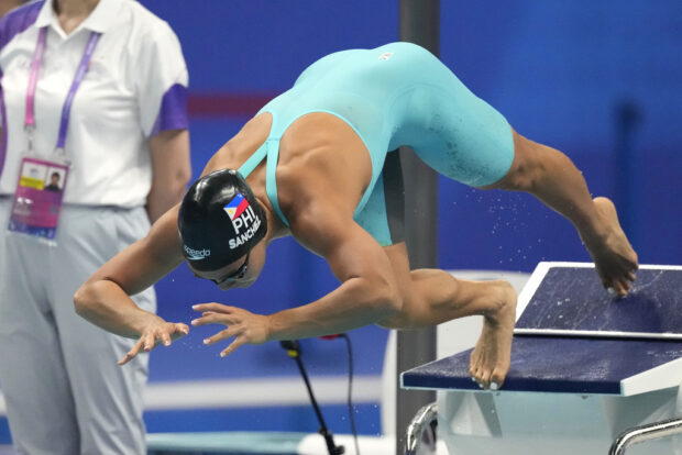 Philippines' Kayla Noelle Sanchez competes during the women's 100m freestyle swimming heat at the 19th Asian Games in Hangzhou, China, Tuesday, Sept. 26, 2023. (AP Photo/Lee Jin-man)