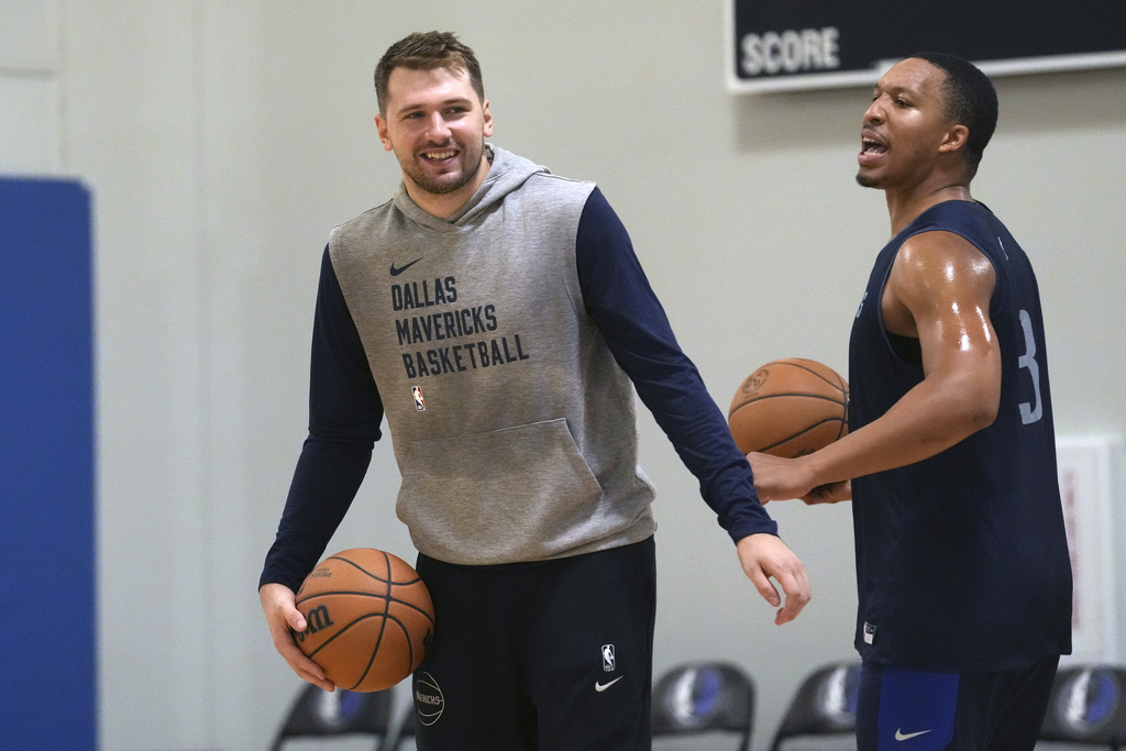 Dallas Mavericks guard Luka Doncic, left, smiles with teammate forward Grant Williams during an NBA basketball training camp in Dallas, Thursday, Sept. 28, 2023.