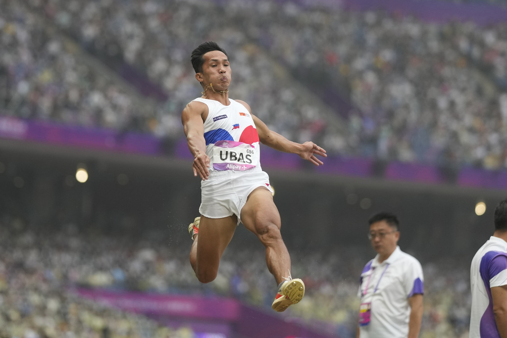 Philippines' Janry Ubas competes during the men's long jump qualification at the 19th Asian Games in Hangzhou, China, 