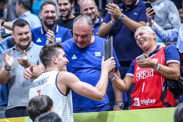 Serbian star Bogdan Bogdanović goes straight to the gallery to greet his family and give his mother a hug after Serbia advances to the Fiba World Cup Final