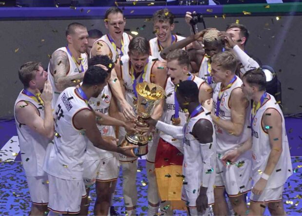 Dennis Schroder and his teammates take a moment to behold their World Cup feat. —AUGUST DELA CRUZ
