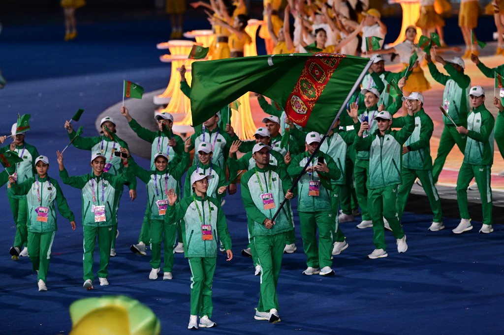 Members of Turkmenistan's delegation take part in the athletes parade during the opening ceremony of the 2022 Asian Games at the Hangzhou Olympic Sports Centre Stadium in Hangzhou in China's eastern Zhejiang province on September 23, 2023.
