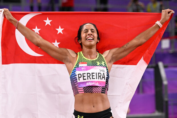 Singapore's Shanti Pereira celebrates winning the women's 200m final athletics event during the 2022 Asian Games in Hangzhou in China's eastern Zhejiang province on October 2, 2023