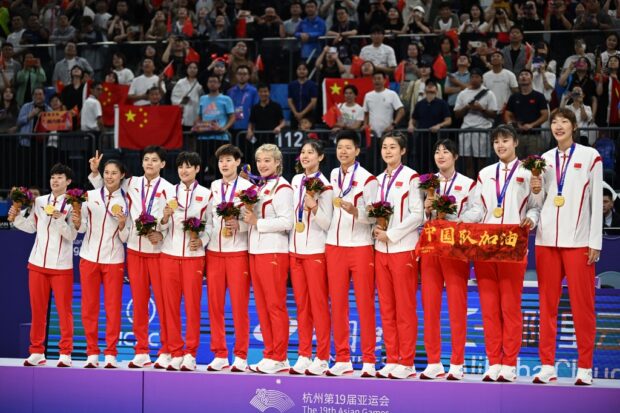 Gold medalist team China celebrate in the podium during the medal ceremony for the women's final basketball game between Japan and China at the Hangzhou 2022 Asian Games in Hangzhou,