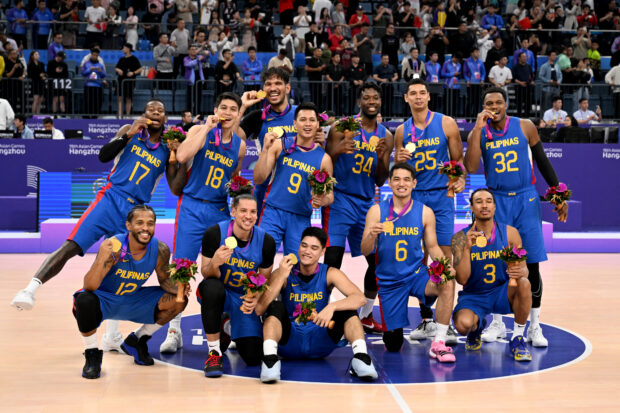 Philippines' players celebrate their win against Jordan at the men's gold medal basketball game between Jordan and Philippines during the 2022 Asian Games in Hangzhou in China's eastern Zhejiang province on October 6, 2023.