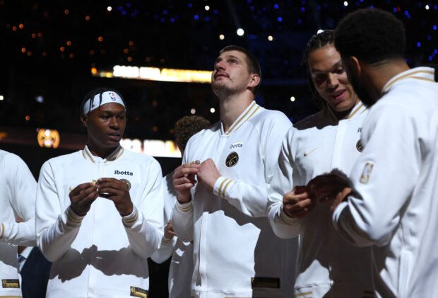  Nikola Jokic #15 of the Denver Nuggets receives his championship ring before the game against the Los Angeles Lakers at Ball Arena on October 24, 2023 in Denver, Colorado. 
