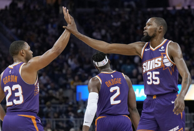 FILE– Kevin Durant #35 and Eric Gordon #23 of the Phoenix Suns 