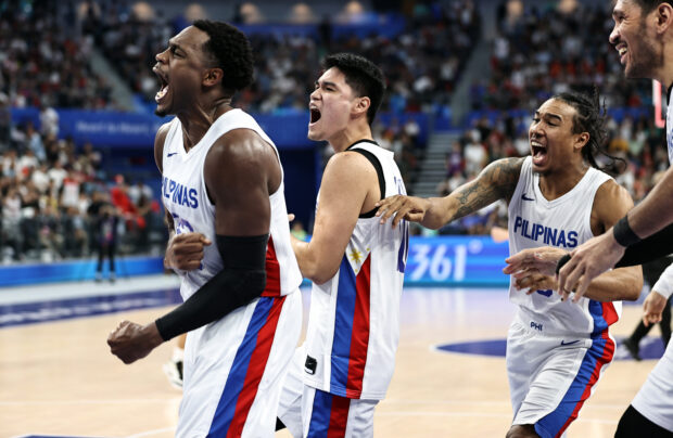 Justin Brownlee and Gilas Pilipinas celebrate victory after the Basketball - Men's Semi-final match between Philippines and China on day 11 of the 19th Asian Games at Hangzhou Olympic Sports Centre Gymnasium on October 4, 2023 in Hangzhou, Zhejiang Province of China.