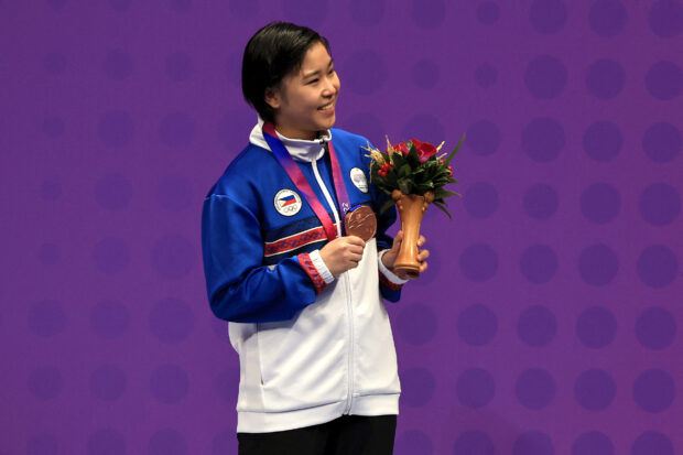 Asian Games - Hangzhou 2022 - Karate - Linping Sports Centre Gymnasium KTE, Hangzhou, China - October 5, 2023 Bronze medallist Philippines' Sakura Alforte poses during the medal ceremony for the 