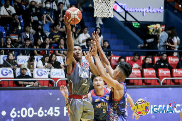 Lyceum's Enoch Valdez soars for a layup against the Arellano Chiefs