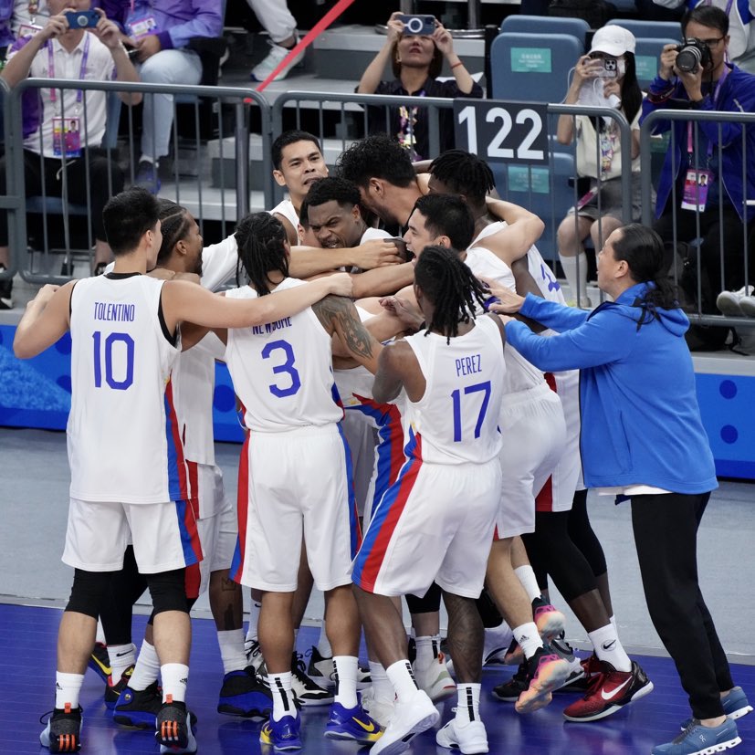 Gilas Pilipinas celebrates semifinal win over China in the 19th Asian Games.