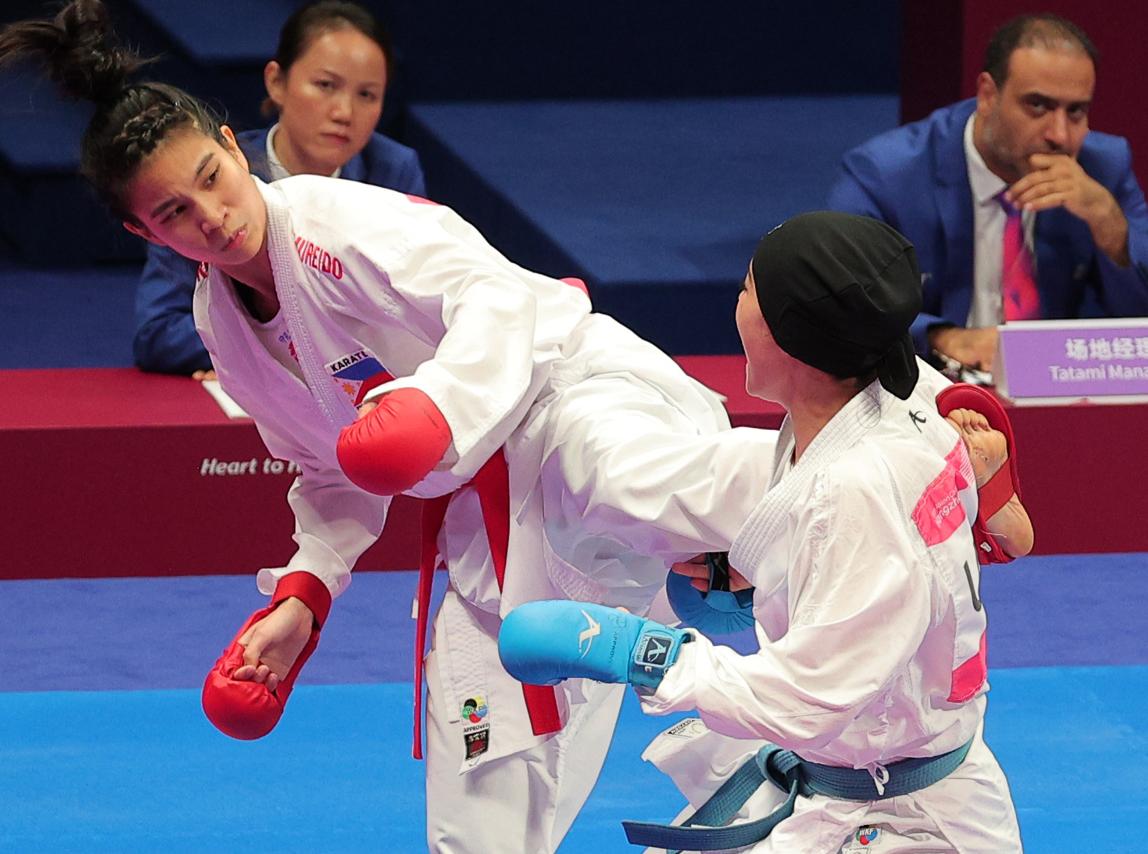 Jamie Christine Lim (left) in the Asian Games karate competition. 