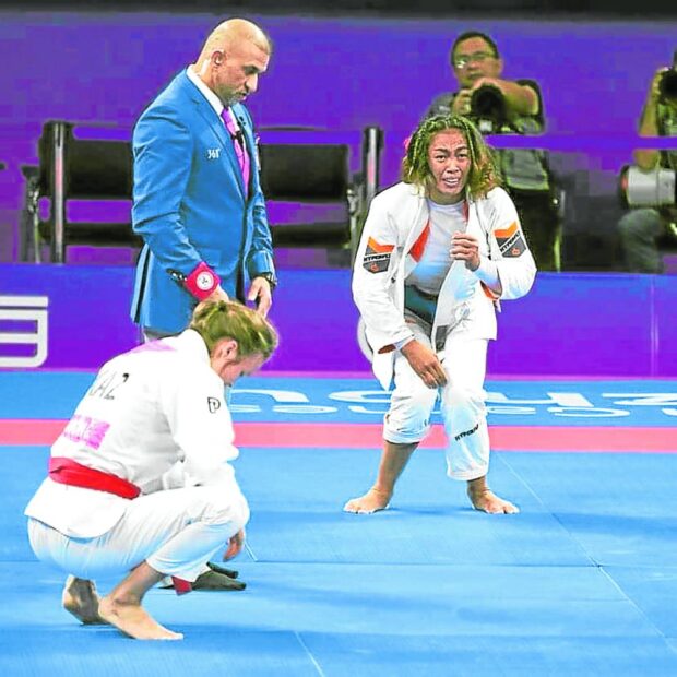 Annie Ramirez reacts after winning the gold in women’s jiu-jitsu in the Asian Games.