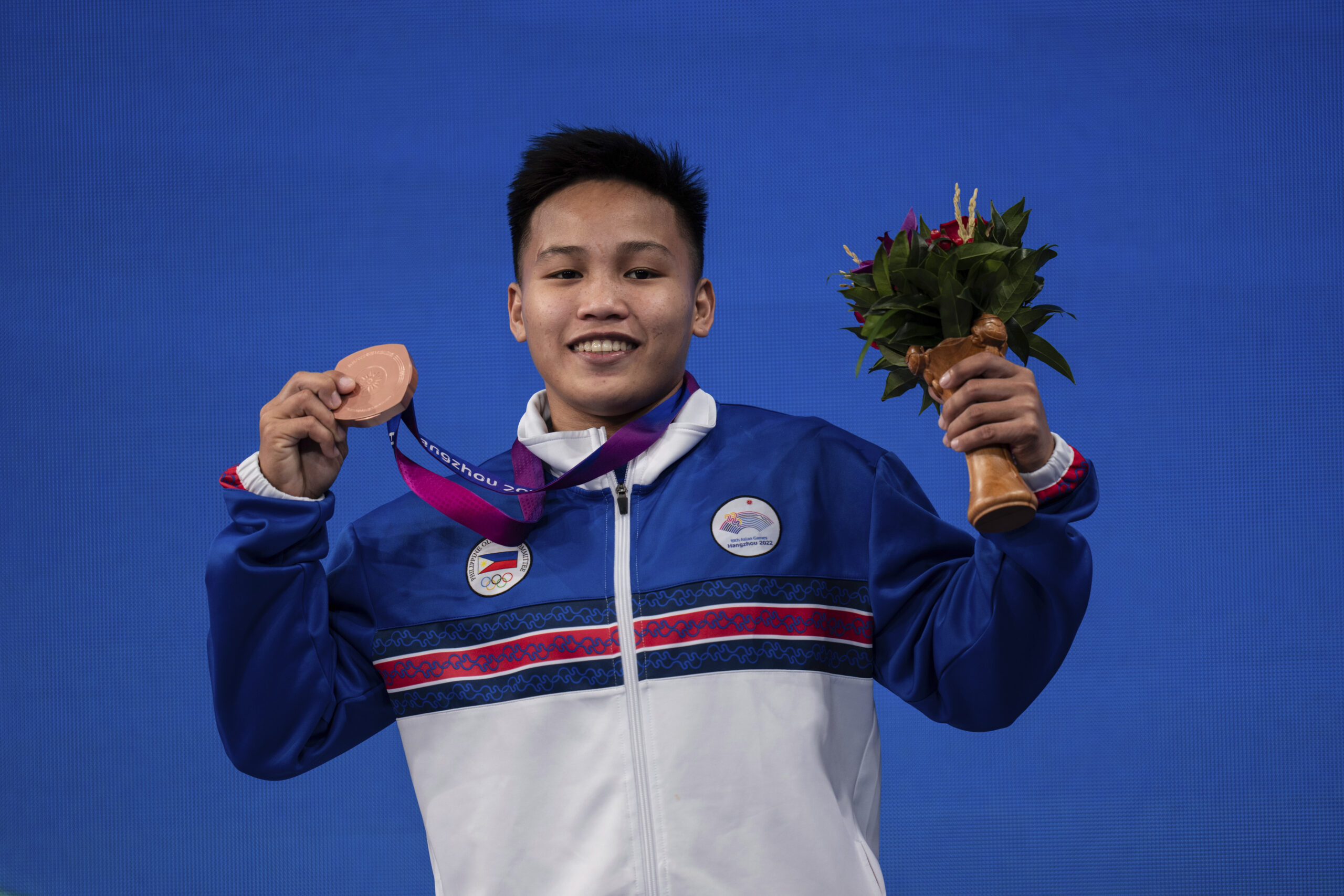 o Elreen reacts with her bronze medal during the awards ceremony after the women's 64kg group A weightlifting gold medal competition at the 19th Asian Games in Hangzhou, China, Monday, Oct. 2, 2023. 