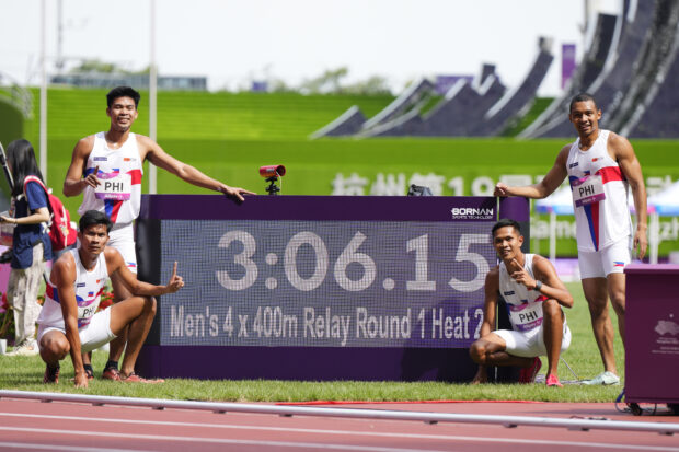 Team Philippines celebrate after finishing first in the men's 4x400-meter relay heat 2 and break their national record at the 19th Asian Games in Hangzhou, China, Tuesday, Oct. 3, 2023.