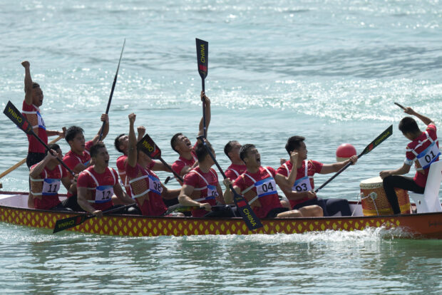 China's dragon boat team celebrate after they win the Men's Dragon Boat 200m Grand Final during the 19th Asian Games at the Wenzhou Dragon Boat Center in Wenzhou, China, Wednesday, Oct. 4, 2023.