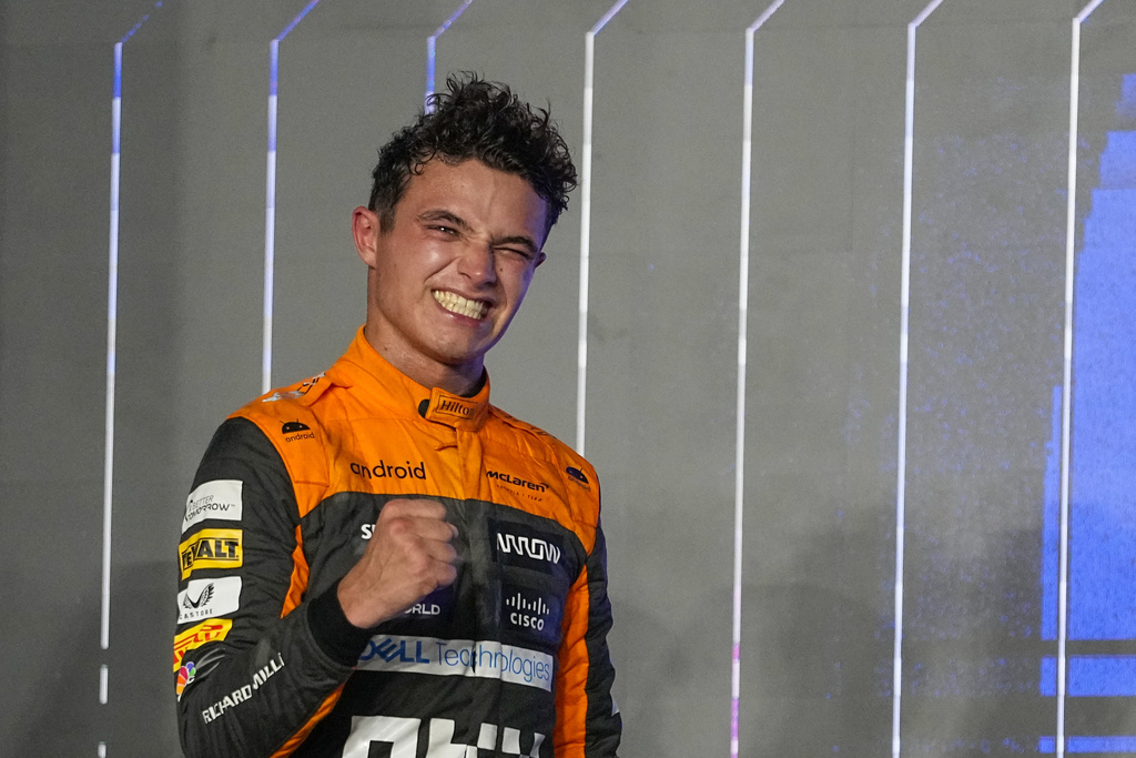 Third placed McLaren driver Lando Norris of Britain celebrates on the podium after the Qatar Formula One Grand Prix auto race at the Lusail International Circuit, in Lusail, Qatar, Sunday, Oct. 8, 2023