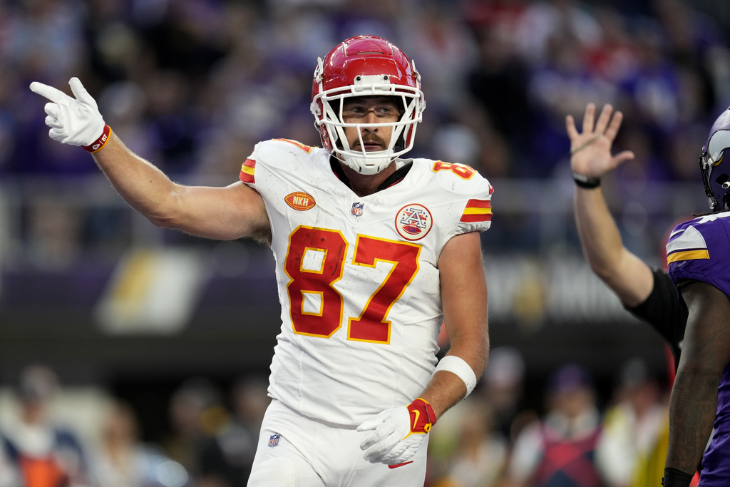 Kansas City Chiefs tight end Travis Kelce (87) reacts after a first down during the second half of an NFL football game against the Minnesota Vikings, Sunday, Oct. 8, 2023, in Minneapolis. 