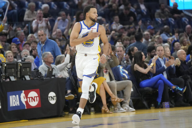 Golden State Warriors guard Stephen Curry gestures after making a 3-point basket against the Phoenix Suns during the first half of an NBA basketball game in San Francisco, Tuesday, Oct. 24, 2023. 