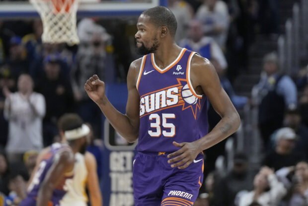 Phoenix Suns forward Kevin Durant celebrates during the second half of the team's NBA basketball game against the Golden State Warriors in San Francisco, Tuesday, Oct. 24, 2023.