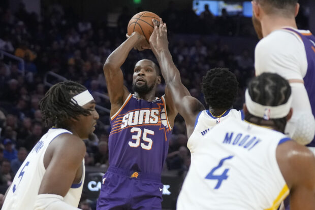 Phoenix Suns forward Kevin Durant (35) shoots against against the Golden State Warriors during the first half of an NBA basketball game in San Francisco, Tuesday, Oct. 24, 2023. 