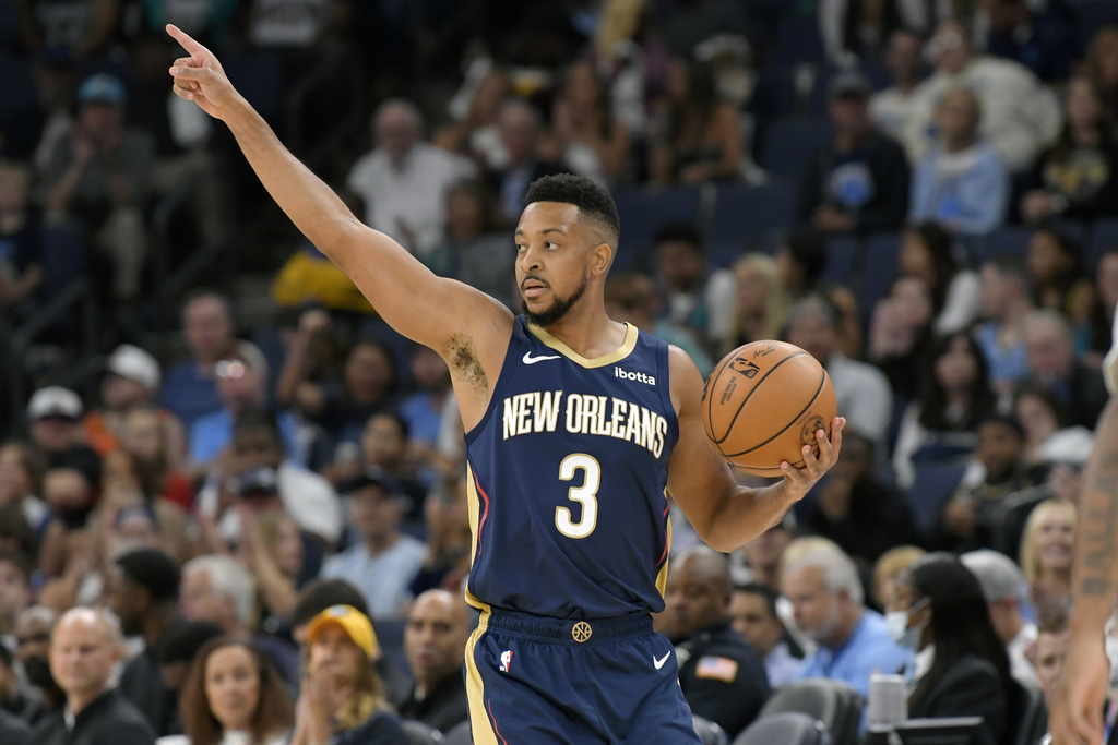 New Orleans Pelicans guard CJ McCollum handles the ball during the first half of the team's NBA basketball game against the Memphis Grizzlies on Wednesday, Oct. 25, 2023, in Memphis, Tenn. 