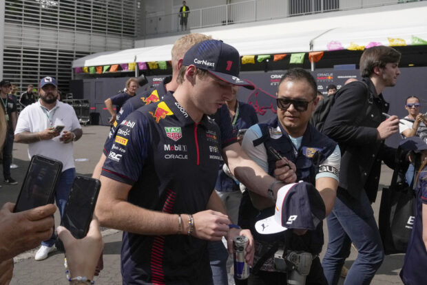 Red Bull driver Max Verstappen of the Netherlands signs autographs upon his arrival to the Hermanos Rodriguez race track in Mexico City, Thursday, Oct. 26, 2023