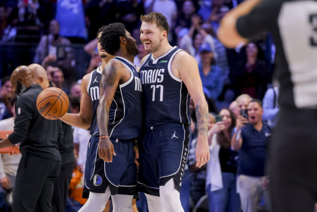 Dallas Mavericks' Luka Doncic (77) and Kyrie Irving (11) celebrate during the second half of the team's NBA basketball game against the Brooklyn Nets, Friday, Oct. 27, 2023, in Dallas. 