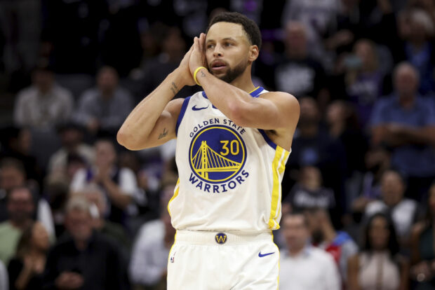 Golden State Warriors guard Stephen Curry celebrates after scoring against the Sacramento Kings during the second half of an NBA basketball game in Sacramento, Calif, Friday, Oct. 27, 2023. 