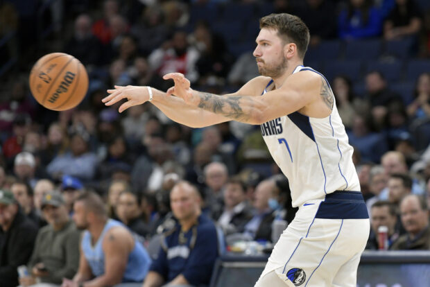 Dallas Mavericks guard Luka Doncic (77) passes the ball in the first half of an NBA basketball game against the Memphis Grizzlies, Monday, Oct. 30, 2023, in Memphis,
