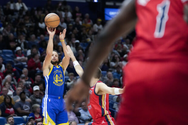 Golden State Warriors guard Stephen Curry (30) shoots a 3-point shot in the first half of an NBA basketball game against the New Orleans Pelicans in New Orleans, Monday, Oct. 30, 2023. 