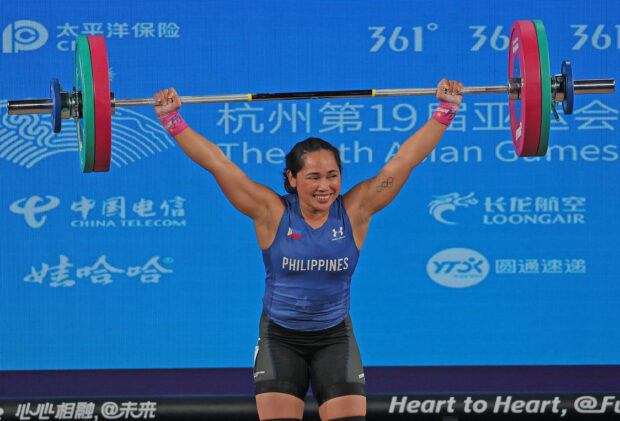 Hidilyn Diaz-Naranjo has something to smile about despite dropping out of the medal race in weightlifting. —ASIAN GAMES POOL