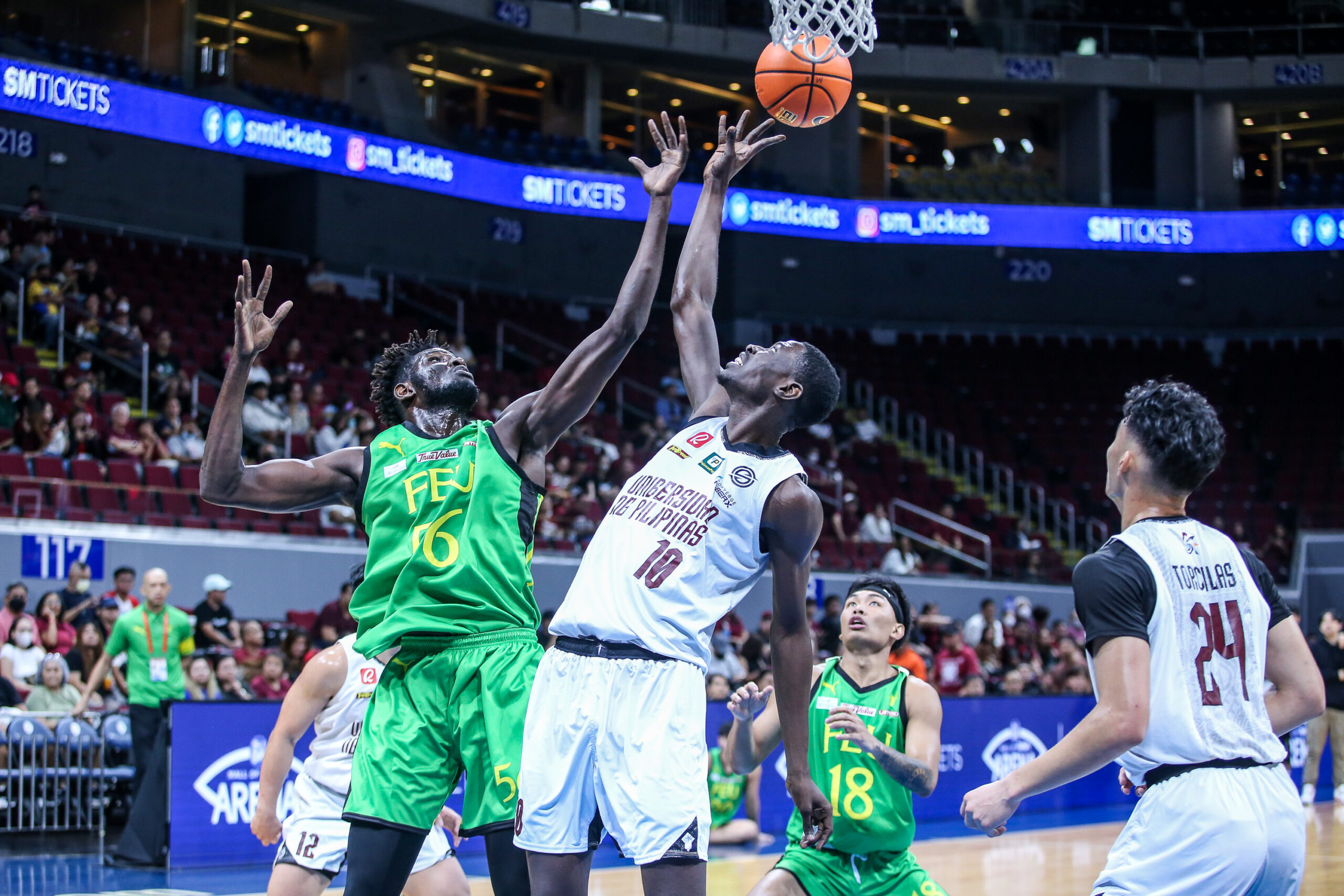 UP's Malick Diouf against FEU's Mo Faty in the UAAP Season 86 men's basketball tournament. -MARLO 