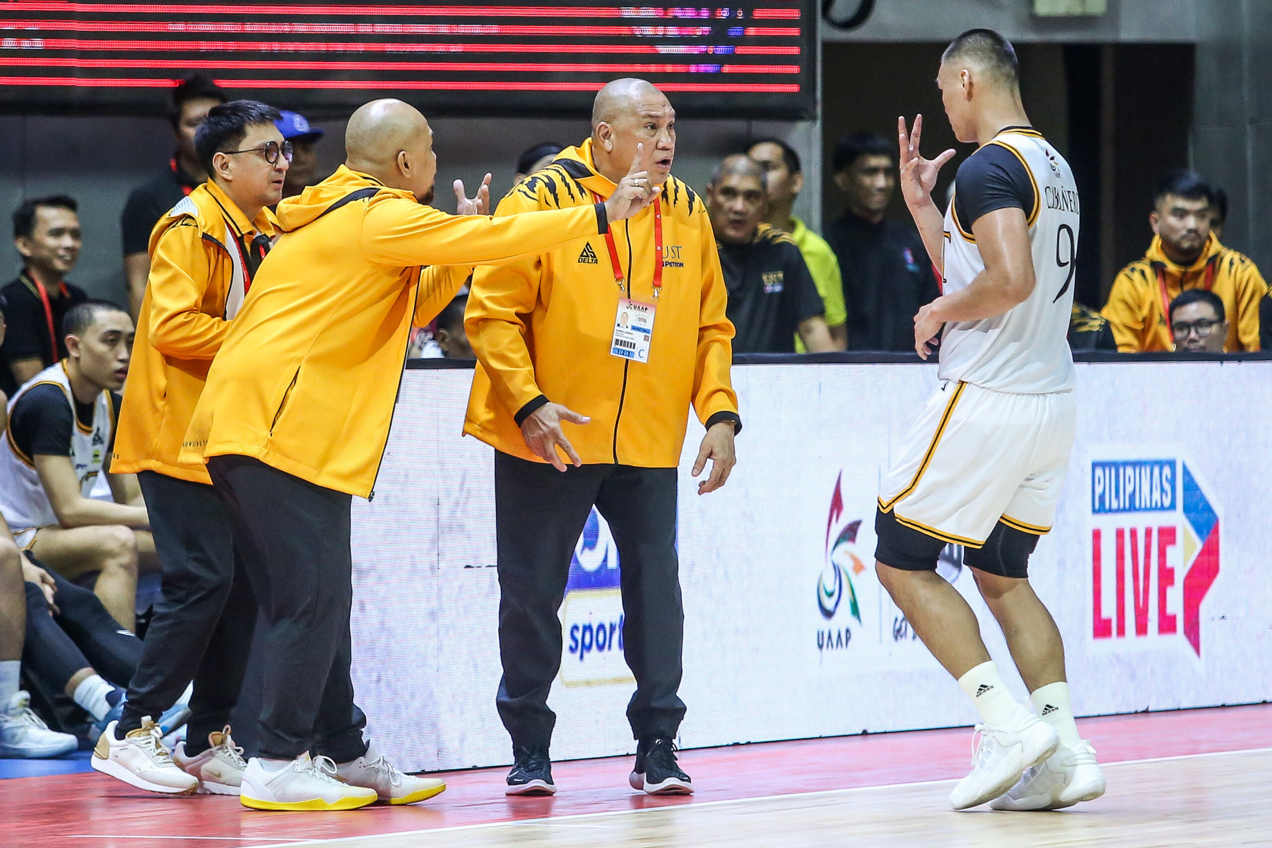 FILE–UST coach Pido Jarencio and the UST Growling Tigers coaching staff.
