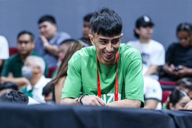 La Salle's Evan Nelle in street clothes in the Green Archers' game against University of the Philippines in the UAAP Season 86 men's basketball tournament.