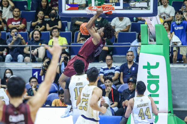 UP's Francis Lopez soars for a dunk against NU in the UAAP Season 86 men's basketball tournament