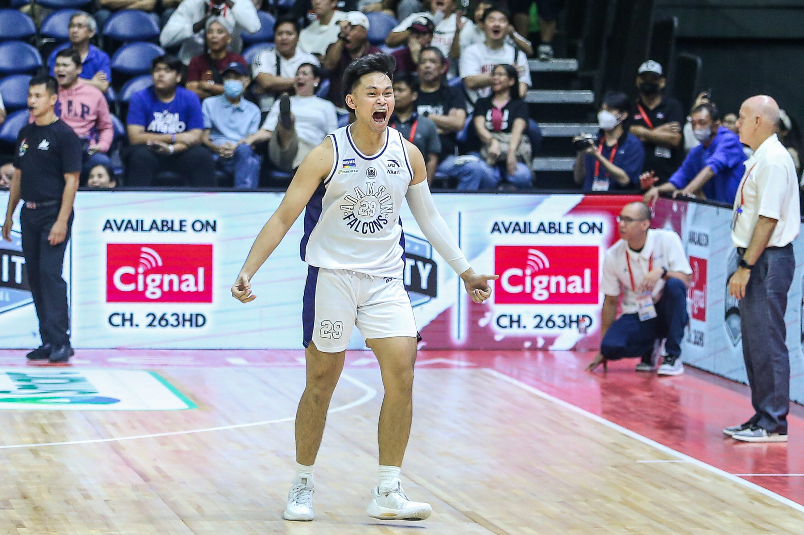 Adamson's Vince Magbuhos celebrates after squeaking past Ateneo on a buzzer-beating triple in overtime. 