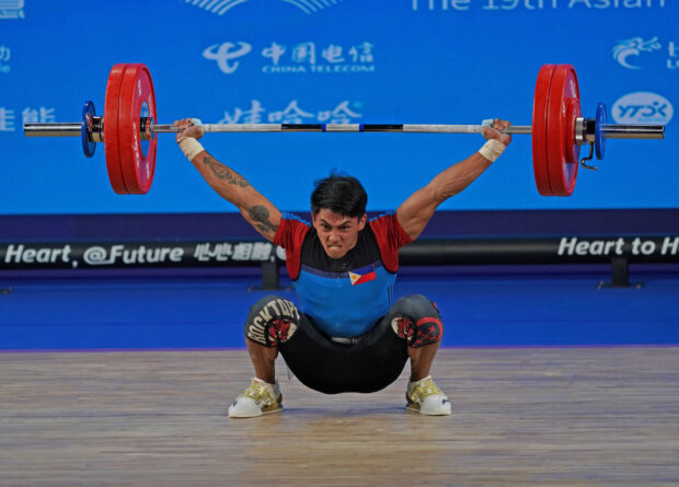 John Ceniza lifts during the weightlifting competition of the 19th Asian Games being held in Hangzhou China. PSC-POC Media Poo