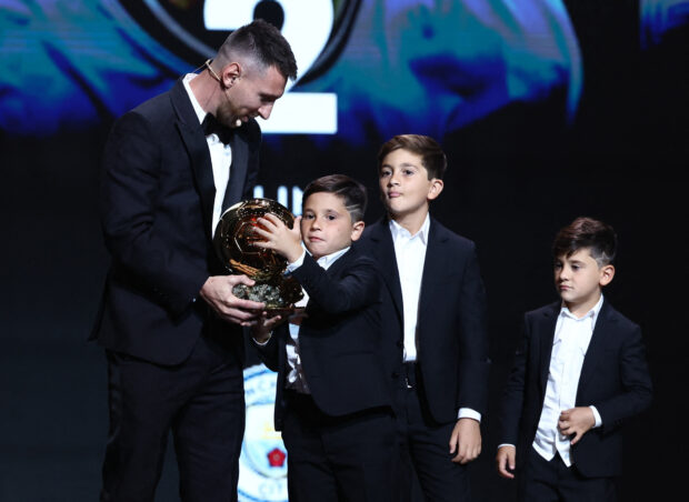 Football - Ballon d'Or 2023 - Chatelet Theater, Paris, France - October 30, 2023 Lionel Messi of Inter Miami after winning the men's Ballon d'Or with his sons Thiago, Mateo and Ciro