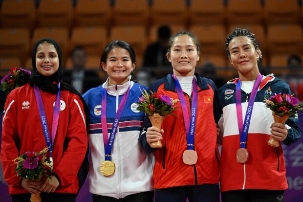 Gold medallist Philippines' Margarita Ochoa (2L), silver medallist United Arab Emirates's Balqees Abdulla (1L), bronze medallists Vietnam's Phung Thi Hue (2R) and Thailand's Pechrada Kacie pose for a photograph at a medal ceremony for Ju-jitsu women's 48kg event during the Hangzhou 2022 Asian Games in Hangzhou, in China's eastern Zhejiang province on October 5, 2023.