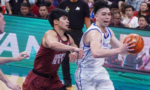 Chris Koon (right) and Ateneo dealt the first blow in their rivalry with CJ Cansino and UP. —AUGUST DELA CRUZ