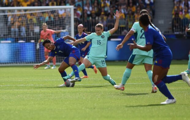 Filipinas striker Sarina Bolden (left) struggles to keep ball possession against Matildas defender Clare Hunt. —PHILIPPINE WOMEN’S FOOTBALL TEAM