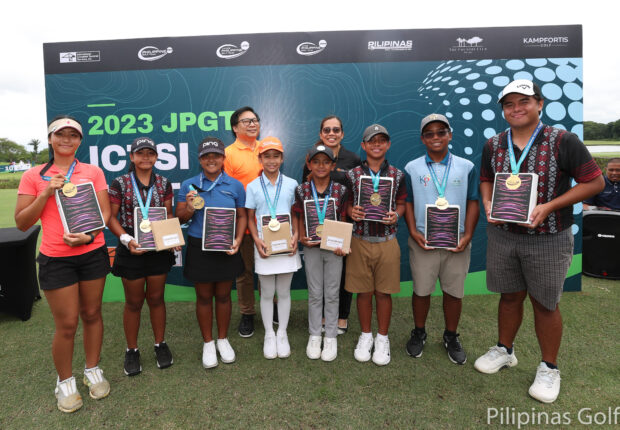 Winners of the inaugural ICTSI Junior PGT Series display their medals and prizes after the 18-hole stroke play finals at The Country Club yesterday. They are (from left) Jiwon Lee (15-18), Isabella Tabanas (13-14), Precious Zaragosa (11-12), Quincy Pilac (9-10), Jared Saban (9-10), Ralph Batican (11-12), Patrick Tambalque (13-14) and Zeus Sara (15-18). –CONTRIBUTED PH