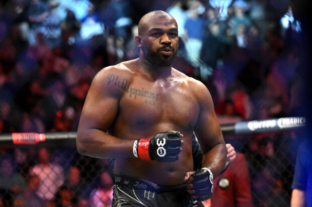 US mixed martial arts fighter Jon Jones celebrates after defeating French mixed martial arts fighter Ciryl Gane during their UFC 285 heavyweight title bout at T-Mobile Arena, in Las Vegas, Nevada, on March 4, 2023. 