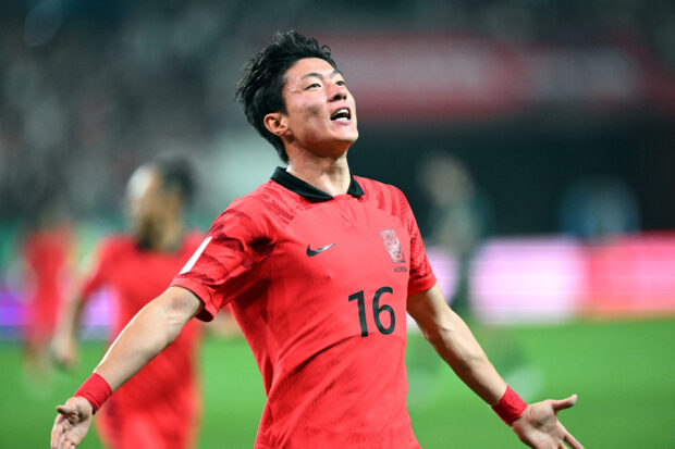 South Korea's Hwang Ui-jo (#16) celebrates his team's fourth goal against Tunisia during their friendly football match in Seoul on October 13, 2023.