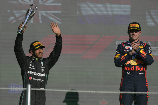 Mercedes' British driver Lewis Hamilton (L) and Red Bull Racing's Dutch driver Max Verstappen celebrate on the podium after the Formula One Mexico Grand Prix at the Hermanos Rodriguez racetrack in Mexico City on October 29, 2023.