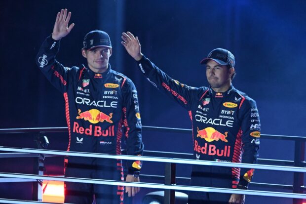Red Bull Racing's Dutch driver Max Verstappen (L) and teammate Red Bull Racing's Mexican driver Sergio Perez participate in the opening ceremony for the Las Vegas Grand Prix on November 15, 2023, in Las Vegas, Nevada.