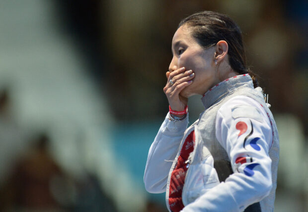 South Korea's Nam Hyun Hee reacts after being defeated by Italy's Valentina Vezzali  at the end of their women's foil bronze medal fencing bout as part of the London 2012 Olympic games, on July 28, 2012 at the ExCel centre in London.